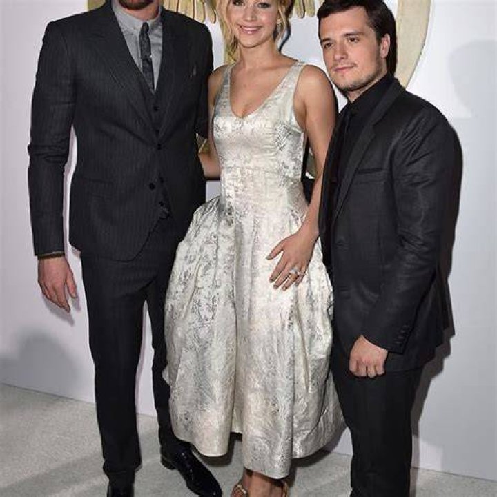 Jennifer Lawrence towers above Josh Hutcherson at LA premiere as film